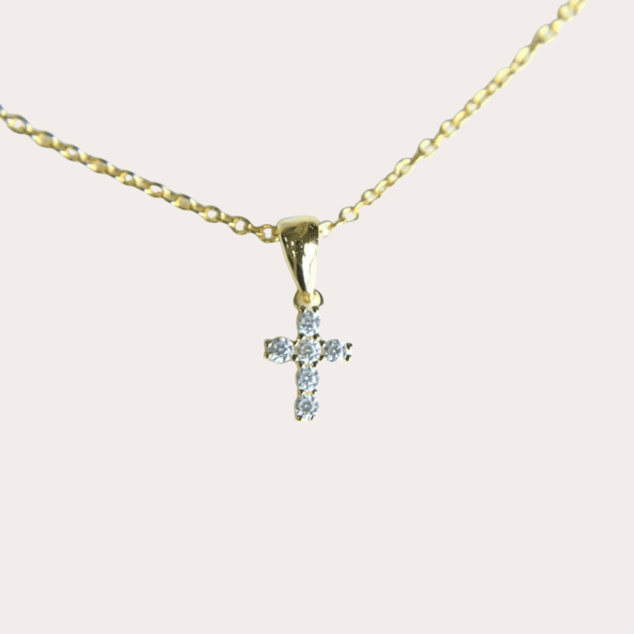 Collier croix Ève classique en finition or, bijou chrétien lumineux